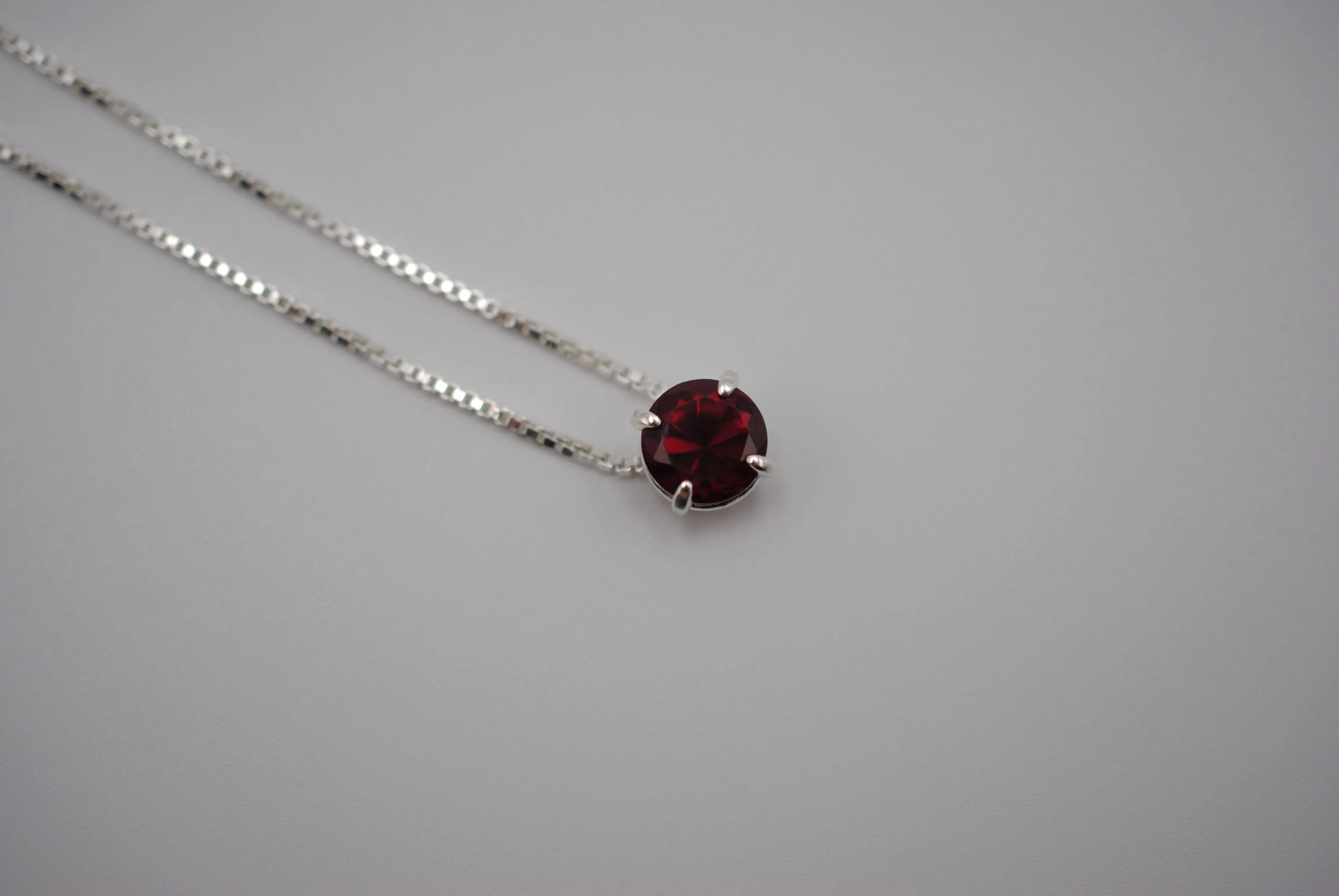 Birthstone Necklace: Round Garnet, Silver Prong Setting, Adjustable Chain