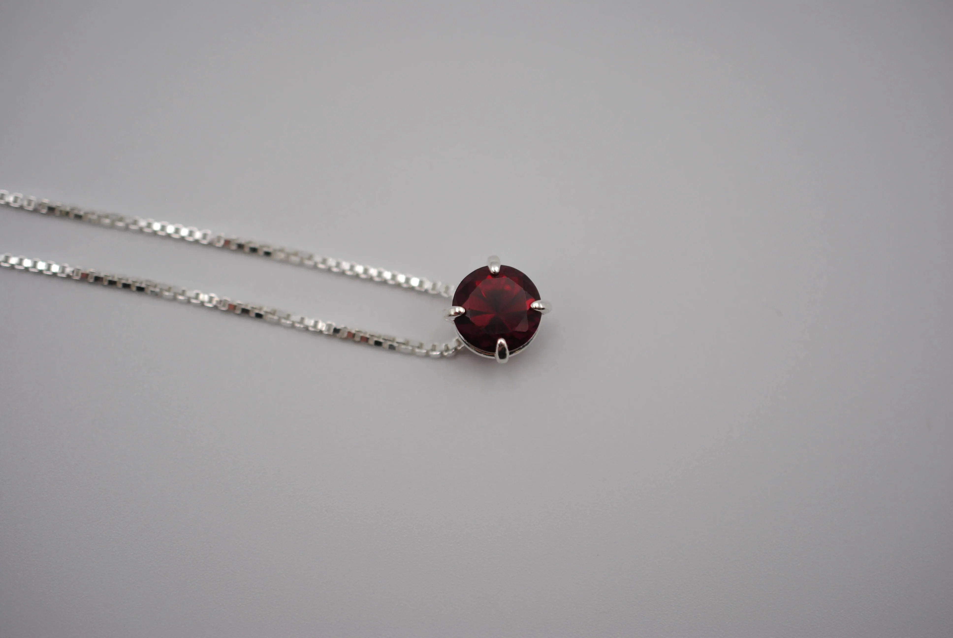 Birthstone Necklace: Round Garnet, Silver Prong Setting, Adjustable Chain
