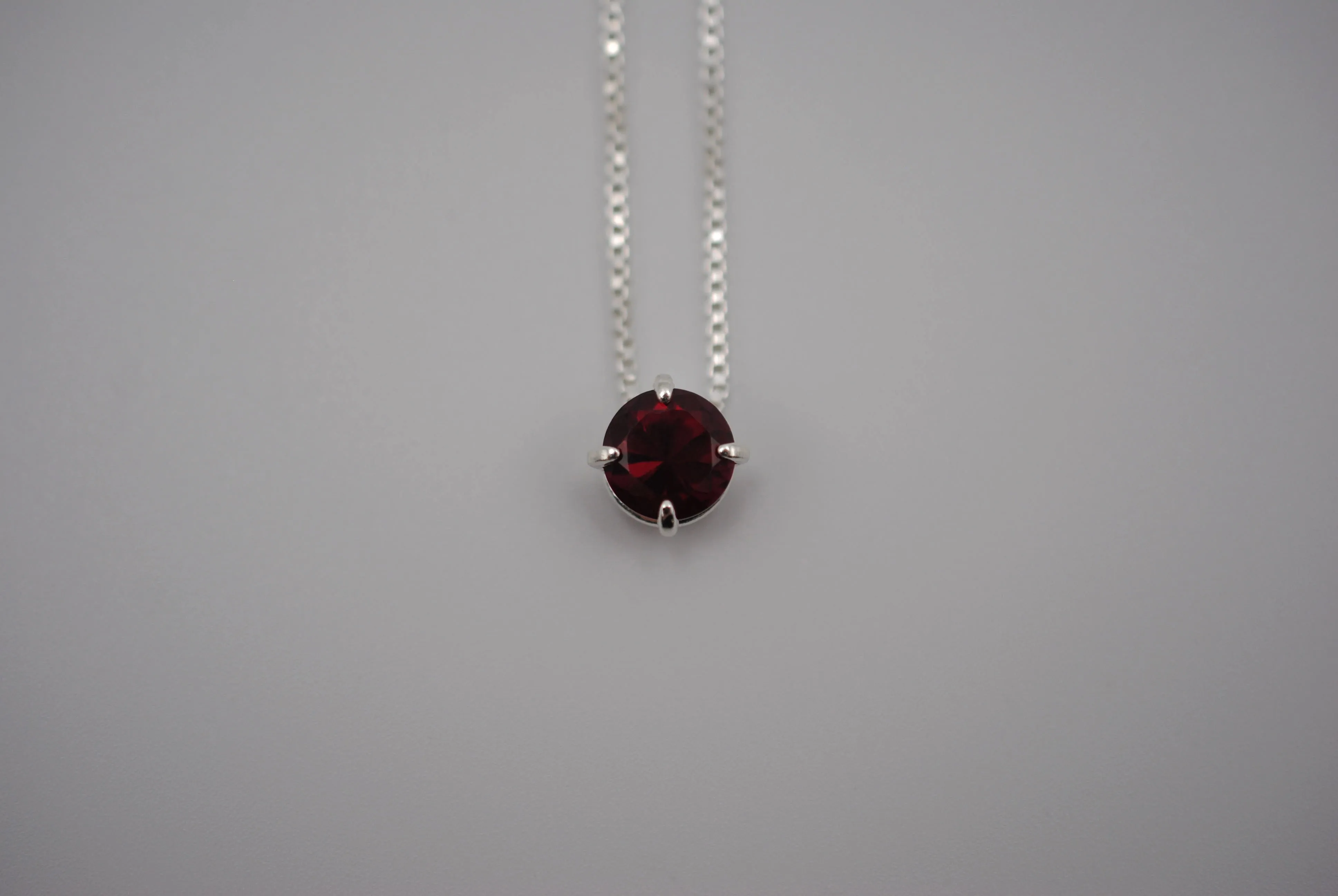Birthstone Necklace: Round Garnet, Silver Prong Setting, Adjustable Chain