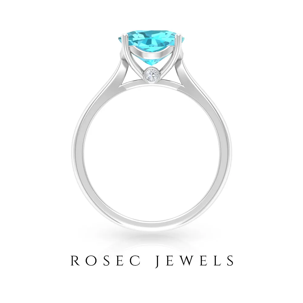 Cushion Cut Swiss Blue Topaz Solitaire Engagement Ring with Surprise Diamond